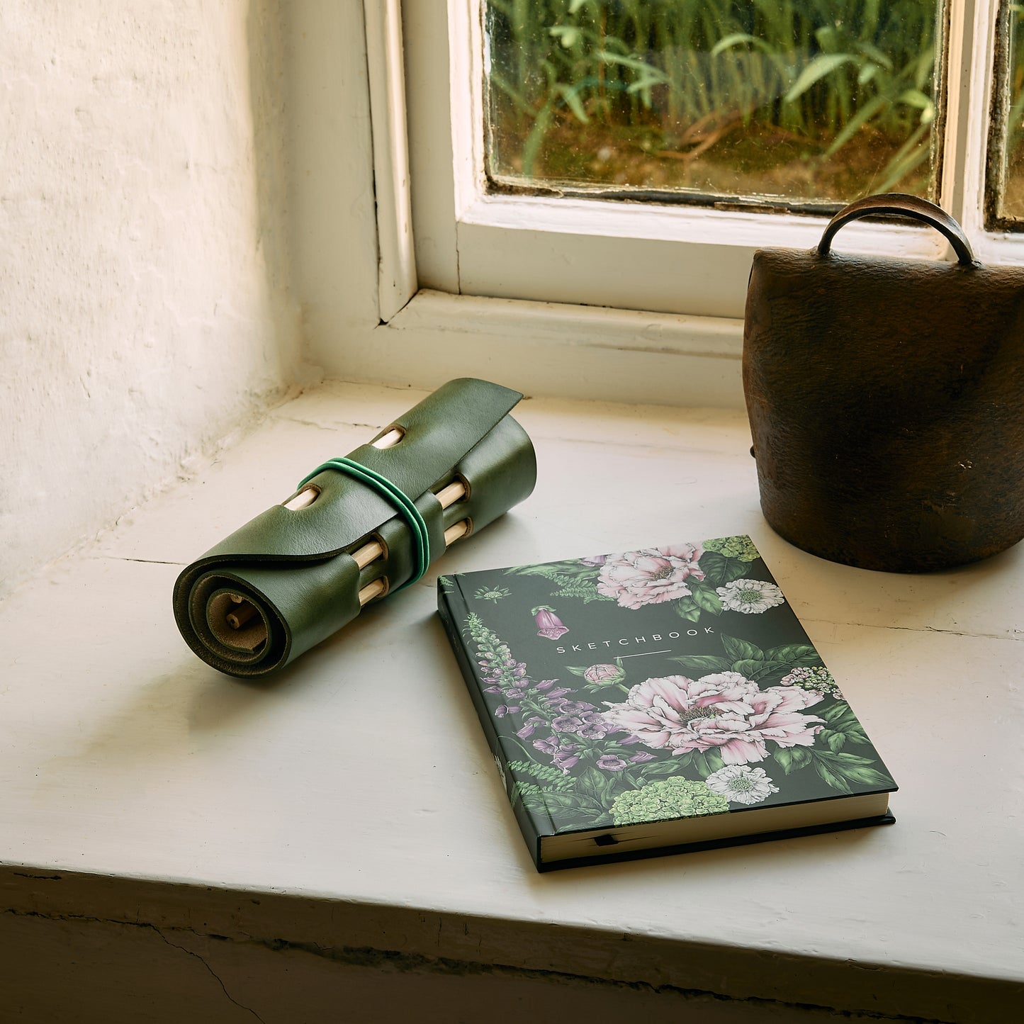 green leather pencil holder